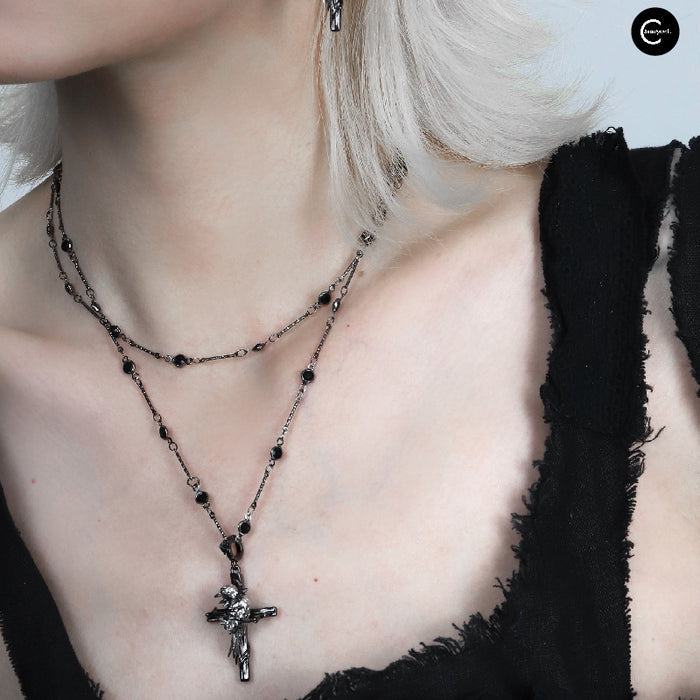 A Part Of Me Raven Series black beaded choker necklace with cross pendant, layered view