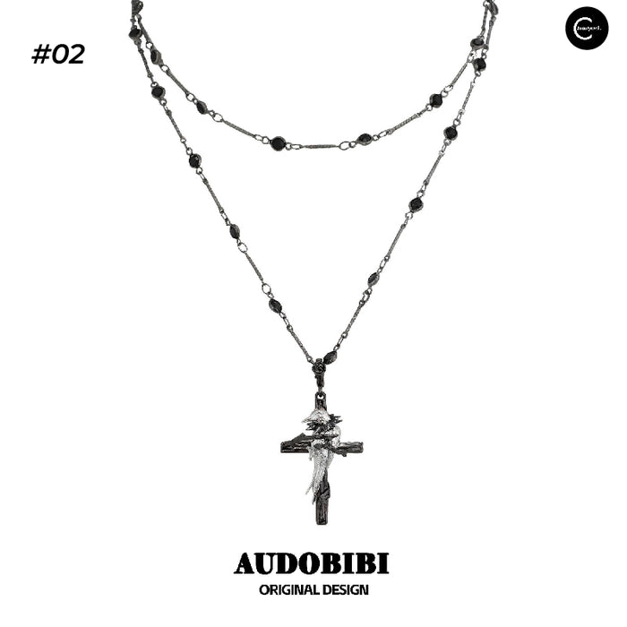A Part Of Me Raven Series #02 choker necklace with layered black bead chains and cross pendant, front view