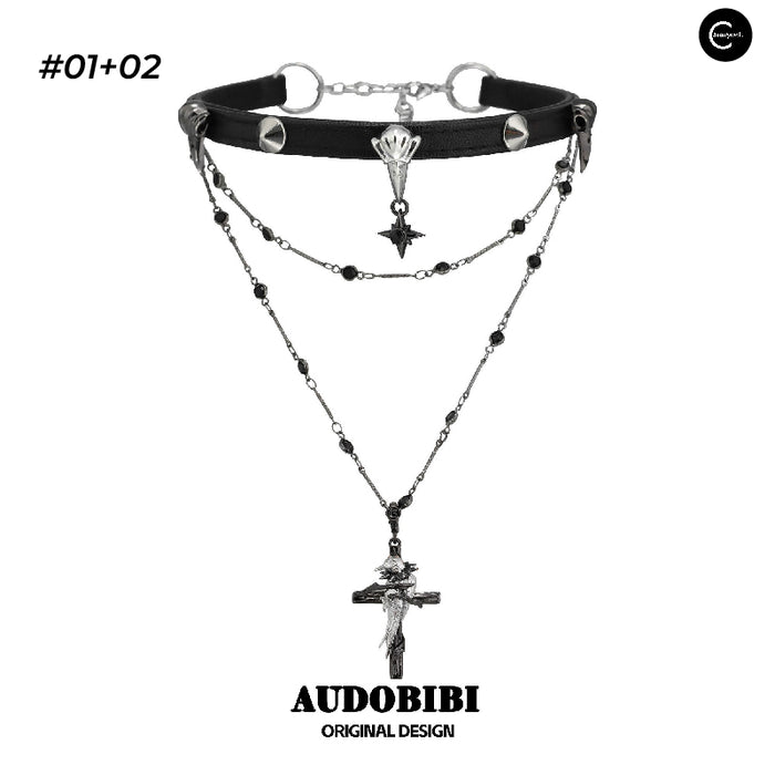 A Part Of Me Raven Series layered black choker necklace with chain details and cross pendant