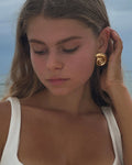 18 Karat Gold Plated / Tarnish and water resistant / High-shine finish