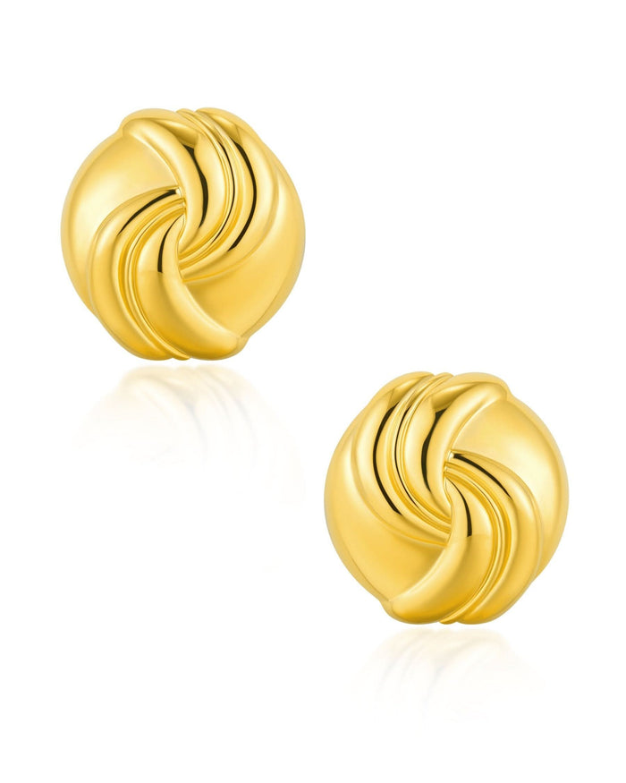 gold statement studs on white backgrouns