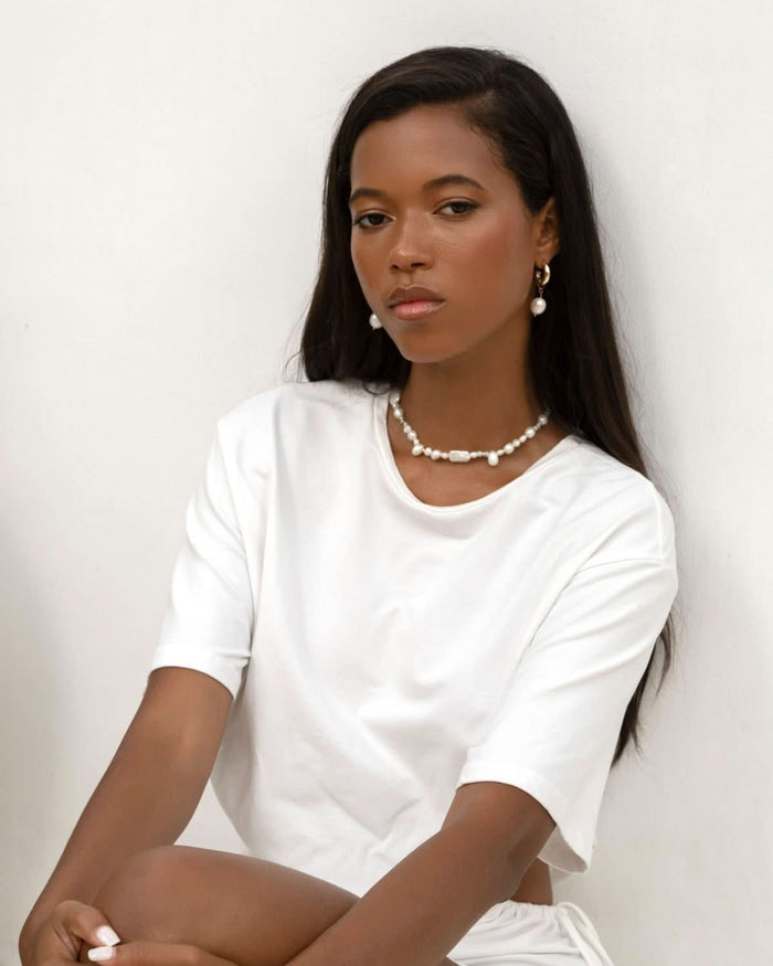pearl earrings and necklace  styled with a white tee shirt