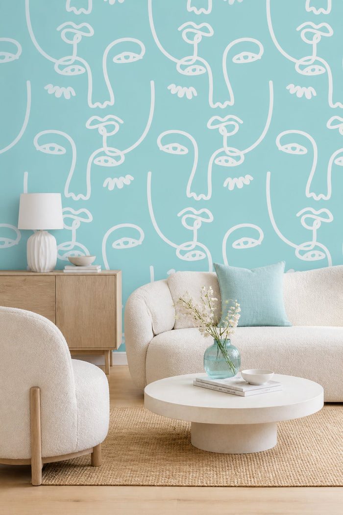 Blue Abstract Faces 2 wall mural in a living room with cream sofa and wood sideboard