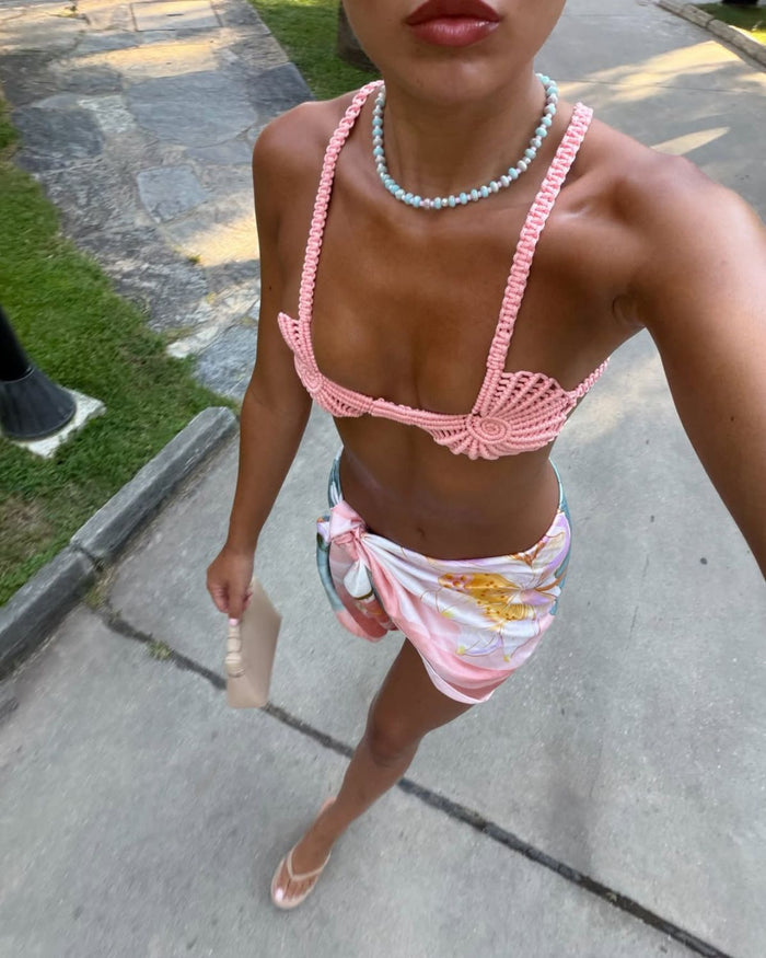 pastel-coloured beaded necklace styled with pink crochet top