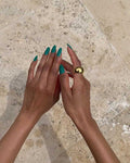 hands featuring a gold thick ring