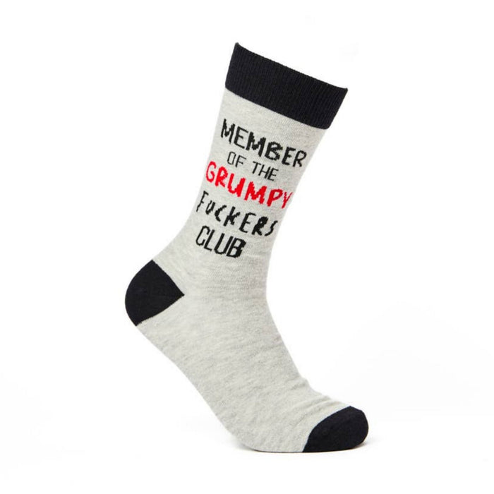 Grey novelty sock with black heel and toe featuring grumpy club slogan angled on white background