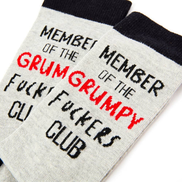 Close up of grumpy club slogan design on novelty socks with bold text