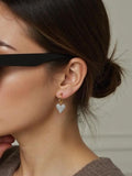 IN CAHOOTS Huggie Earrings