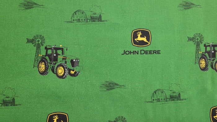 John Deere Logo and tractor on a green background