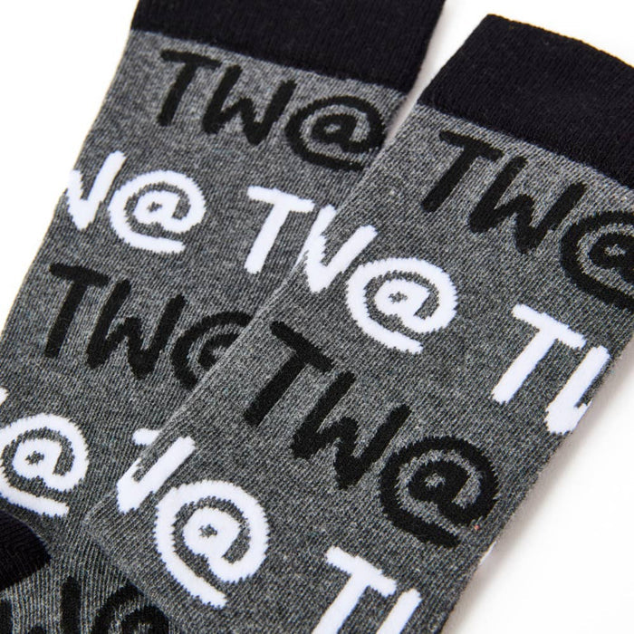 Close up of Tw@ text pattern on men’s novelty socks