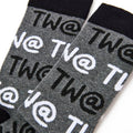 Close up of Tw@ text pattern on men’s novelty socks