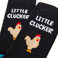 Close up of little clucker slogan and design on novelty socks