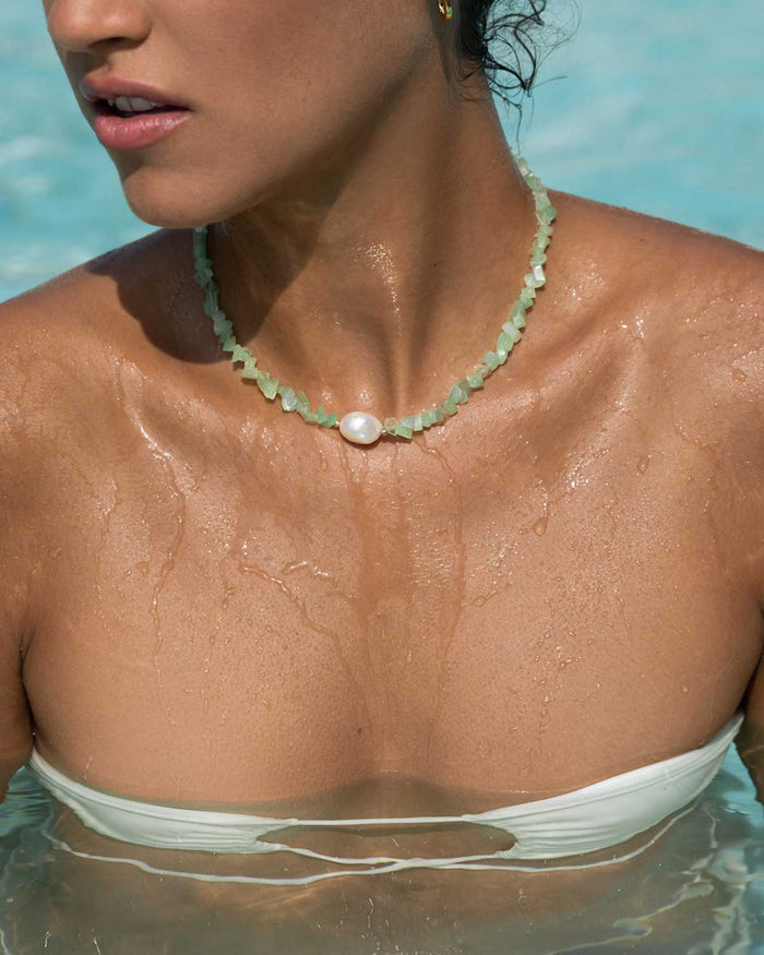 girl in pool wearing a mint bead and pearl choker