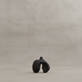 Ni Vase Petit with limewash beige-grey background