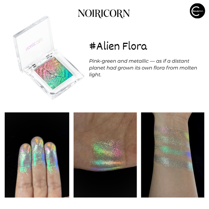 NOIRICORN Alien Flora single eyeshadow pan in an open compact with pink-green metallic pigment swatches