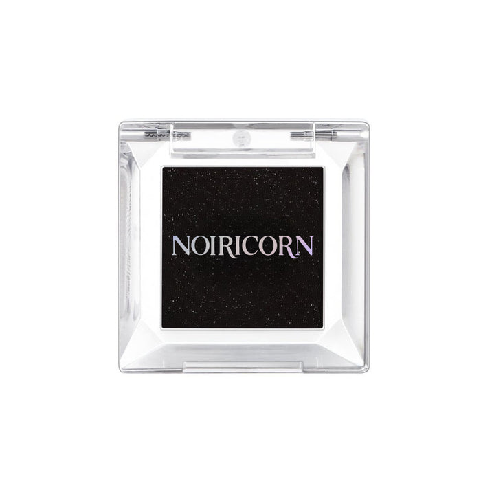 NOIRICORN Noir Spark eyeshadow in a clear square compact, front view