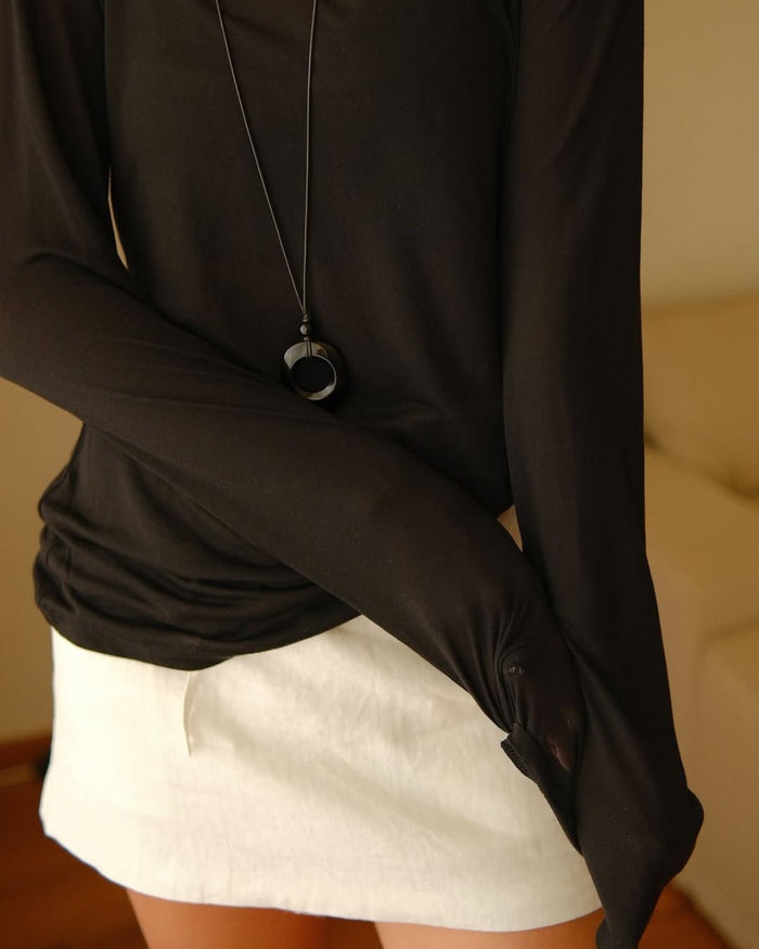 cord necklace with abstract pendant up close
