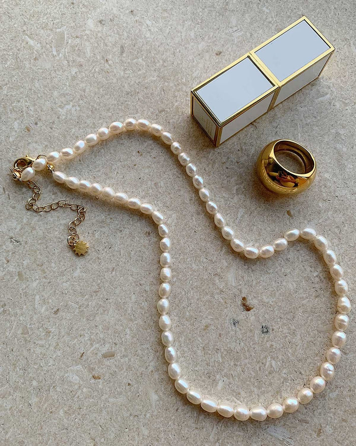 Cult of Sun pearl necklace and gold ring