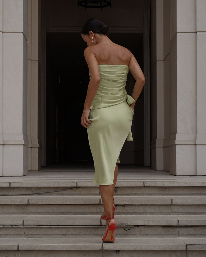 pearl earrings styled with a cocktail dress