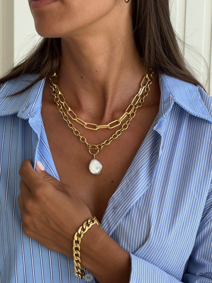 chunky pearl necklace styled with a shirt