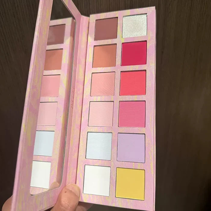 Open pink makeup palette with mirror and 12 colorful powder shades