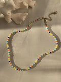 a coral and a beautiful pearl and beaded necklace