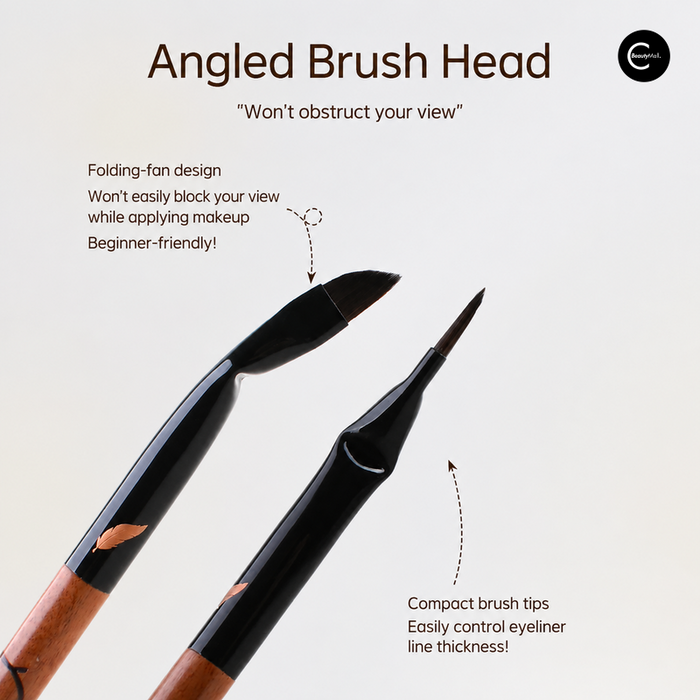 Black angled and fine-tip eye makeup brushes on a white background