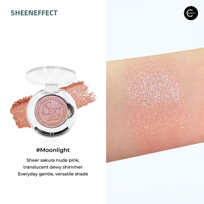 SheenEffect Diamond Highlighter Single Eyeshadow in Moonlight, open compact with pink shimmer swatch on skin