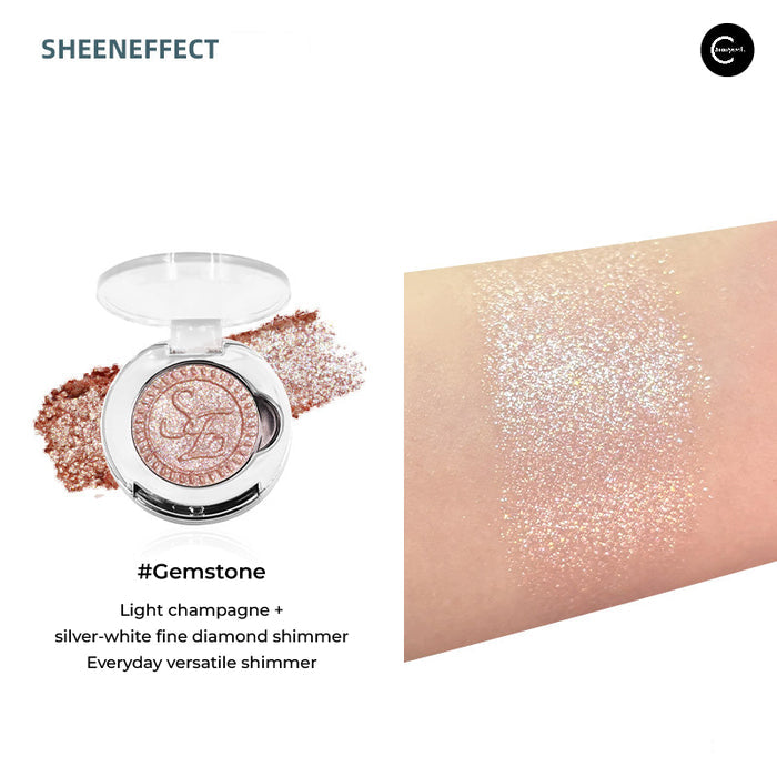 SheenEffect Diamond Highlighter Single Eyeshadow in #Gemstone, open compact with champagne shimmer swatch