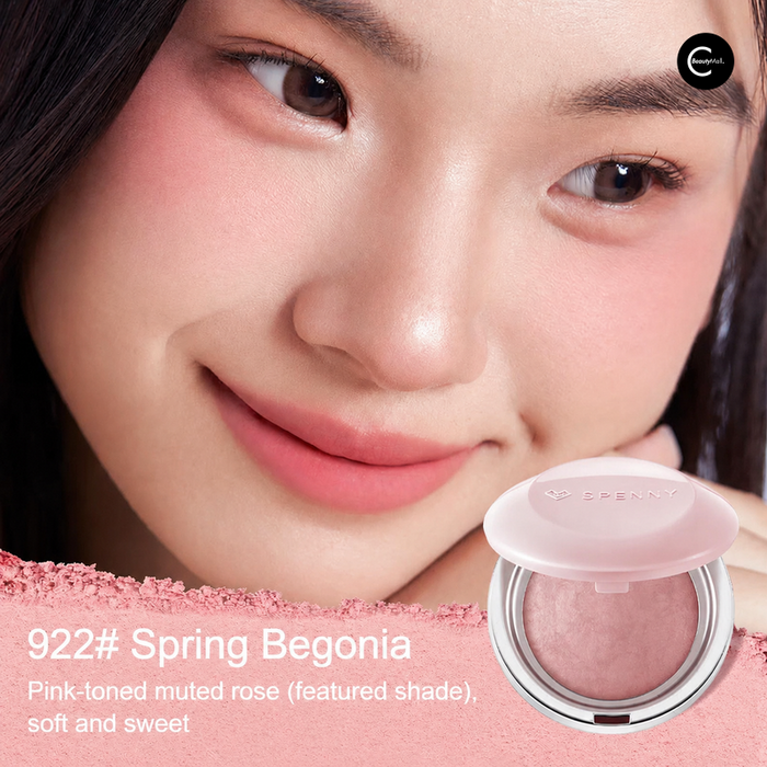 SPENNY compact in shade 922 Spring Begonia shown open beside a model wearing the pink-toned color