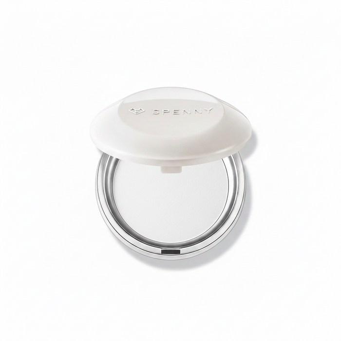 Open SPENNY Soft-Veil Baked Setting Powder compact showing white pressed powder and lid