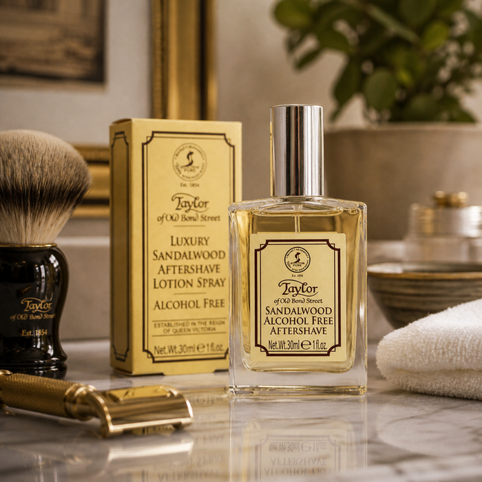 Taylor of Old Bond Street Sandalwood aftershave with grooming accessories in warm bathroom setting