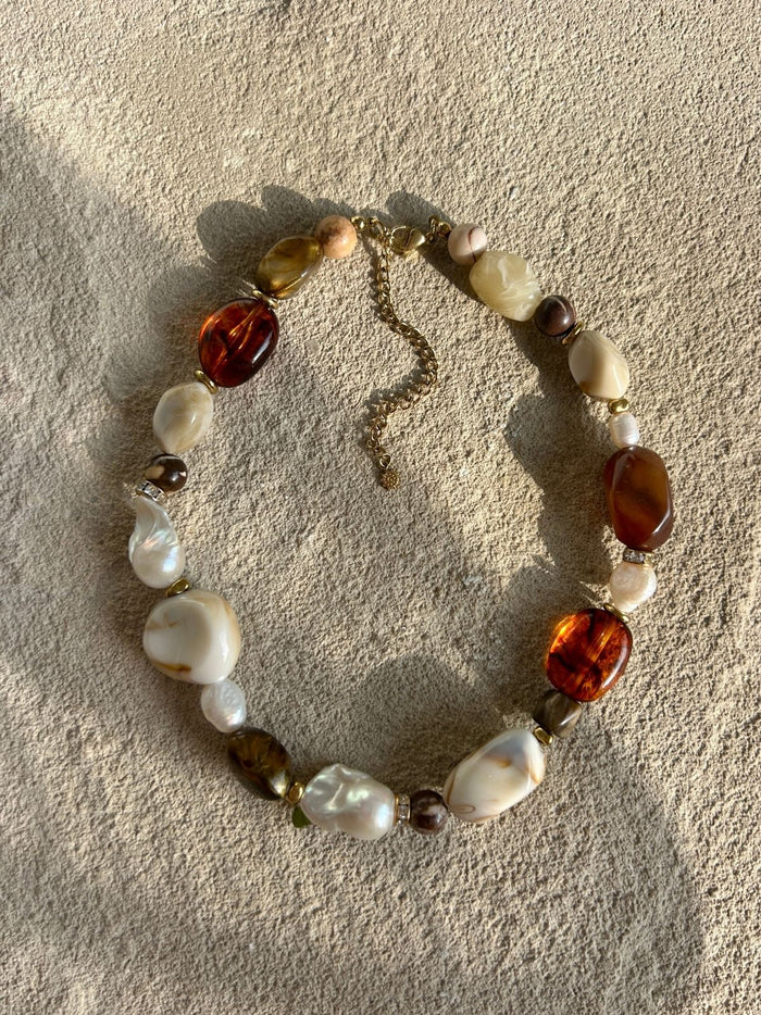 chunky beaded necklace on stone surface