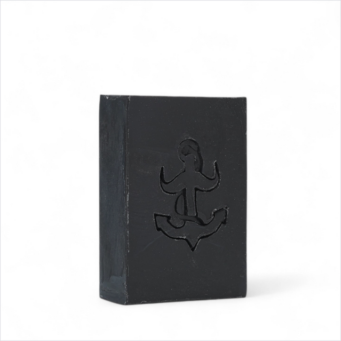 The Brighton Beard Co. The Miller’s Beard Shampoo Bar 100g black soap bar with anchor detail on white background