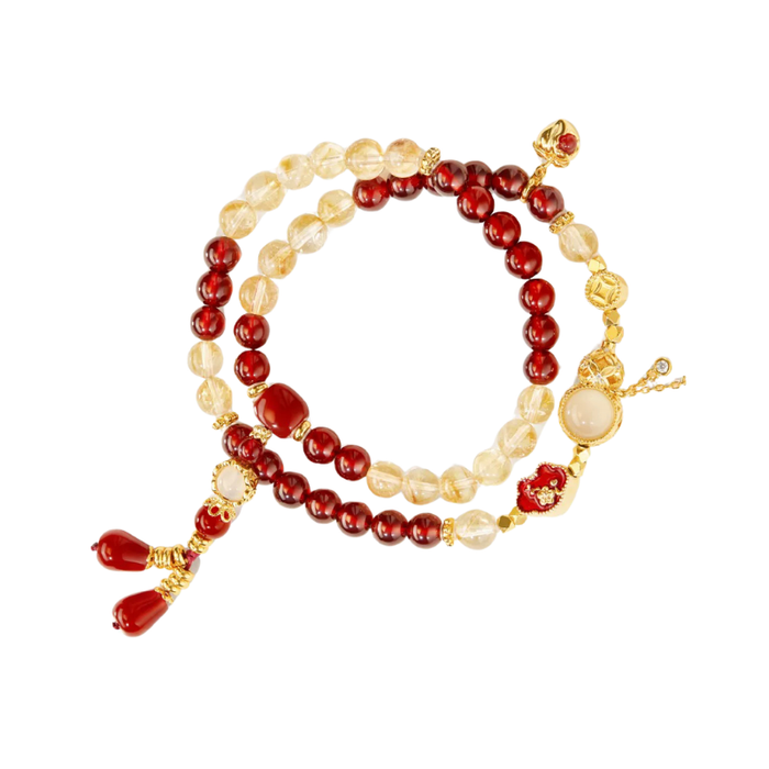 The Palace Museum Five Blessings beaded bracelet, red and translucent beads with gold-tone charms, front view