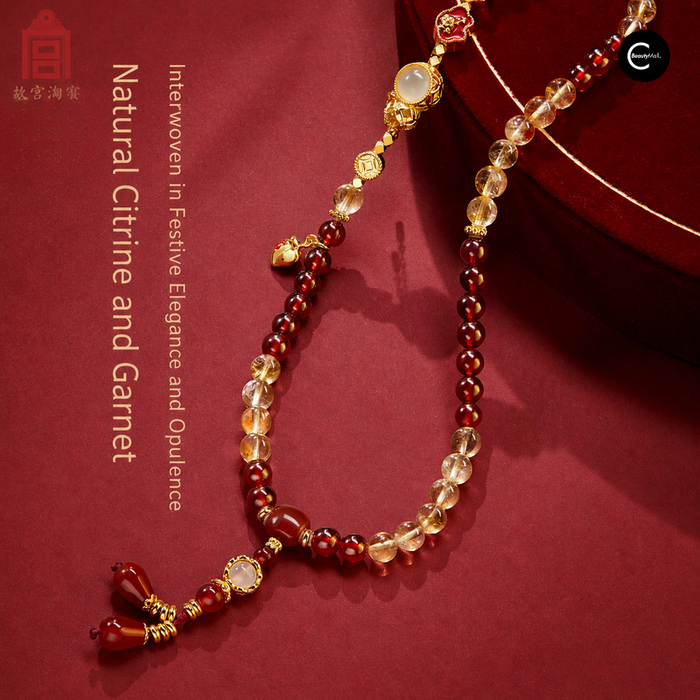 The Palace Museum Five Blessings beaded bracelet with red and clear beads, gold-tone accents, and dangling charms