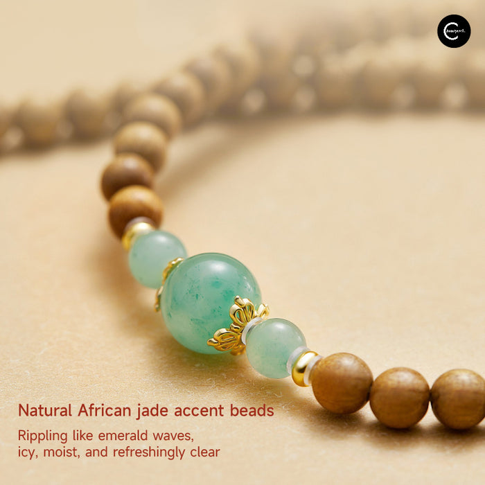 The Palace Museum beaded bracelet with green accent beads and brown wood beads, close-up view
