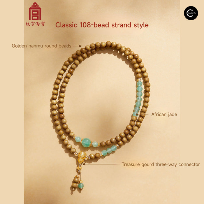 The Palace Museum golden nanmu and green jade beaded bracelet with gold gourd connector, front view