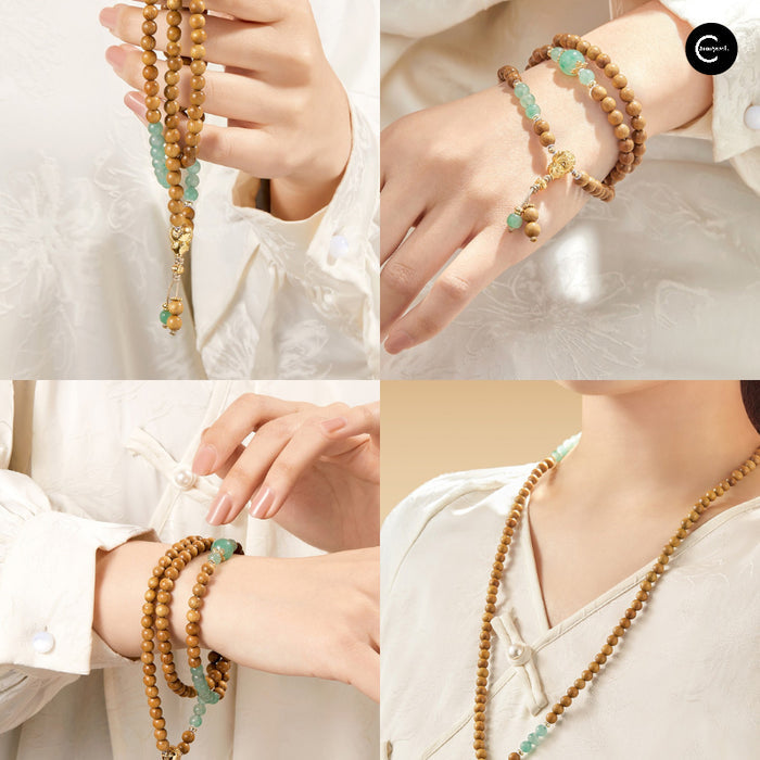 The Palace Museum Golden Jade Gourd Golden Silk Nanmu beaded bracelet in brown and green, shown worn and draped