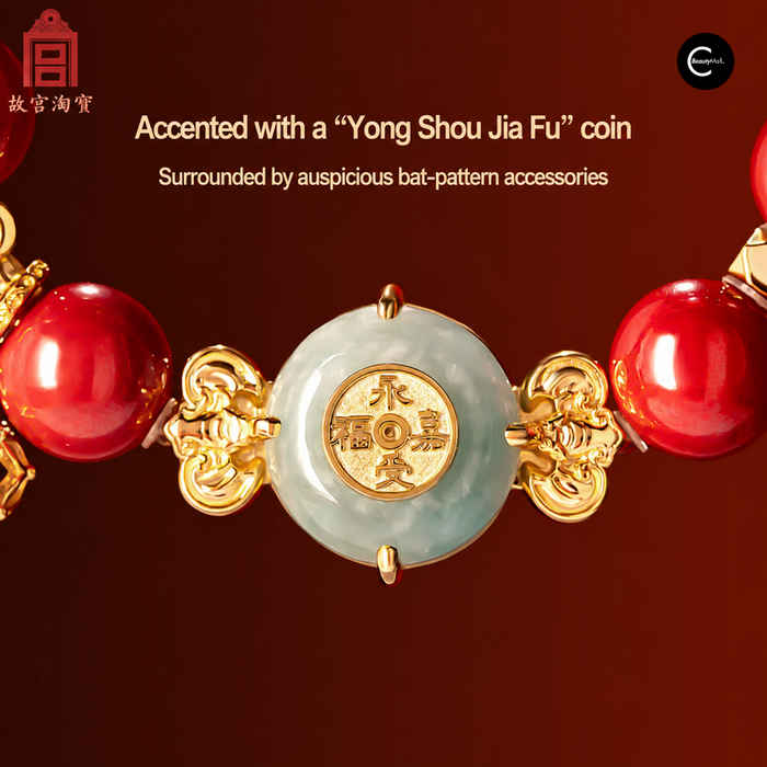 Red, jade, and gold decorative ornament with a coin motif and bat-pattern accessories