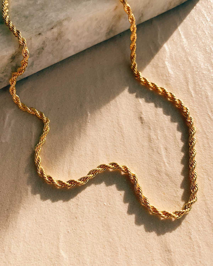 rope chain necklace on textured background