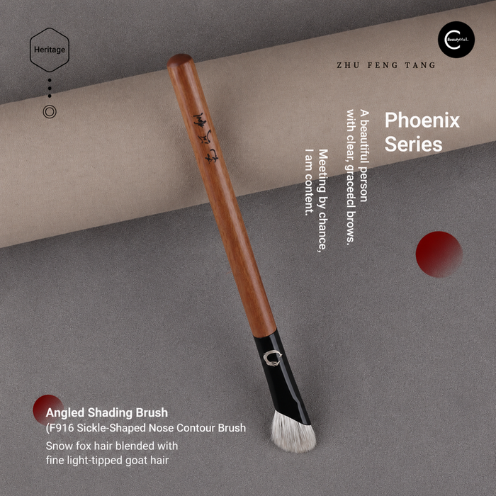 Zhu Feng Tang angled shading makeup brush with wood handle and black ferrule on a gray background